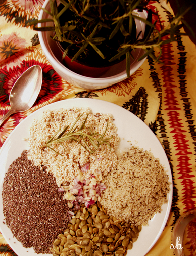 Clockwise starting at top, sprouted quinoa, hemp seeds, pepitas, chia seeds